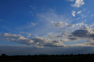 Obraz premium Blue sky and white and gray clouds. Texture background for design.