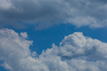 Blue sky and white and gray clouds. Texture background for design.