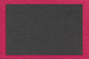 Fototapeta premium Texture craft black paper background with purple border, macro. Structure of vintage kraft magenta cardboard