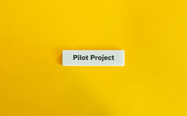 Pilot Project Banner. Text on Block Letter Tile on Yellow Background. Minimal Aesthetic.