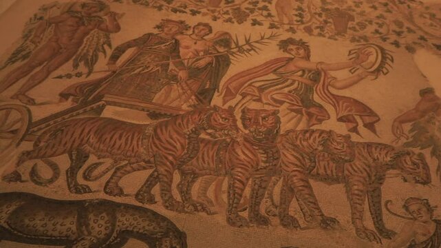 Ancient mosaic artwork depicting tigers and mythological figures in intricate detail