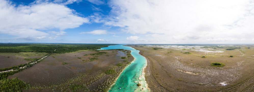 Aerial view of panoramic lagoon Bacalar with clear water and lush greenery, Othon P. Blanco, Mexico.