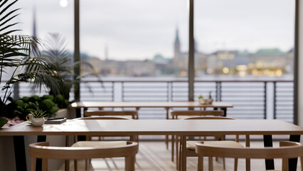A wooden tabletop in a contemporary minimalist restaurant with a stunning city view.