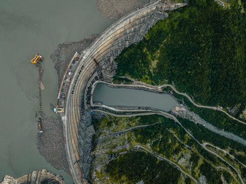 Aerial view of the beautiful Enguri Dam surrounded by lush greenery and mountains, Samegrelo-Zemo Svaneti, Georgia.