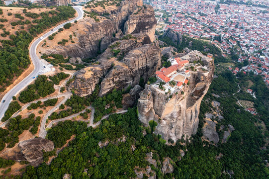 Aerial view of ancient monasteries perched on dramatic rock formations in a beautiful valley, Kalabaka, Greece.