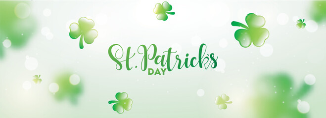 Header or banner design with stylish lettering of St. Patrick's Day and decorative shamrock leaves on blurred background.
