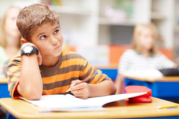 Thinking, student and boy in classroom, notebook and solution for test answers, exam and decision....
