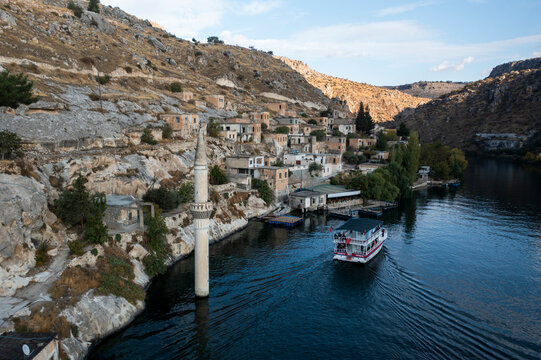 Aerial view of picturesque Halfeti village with stone houses and a serene river, Sanliurfa, Turkiye.