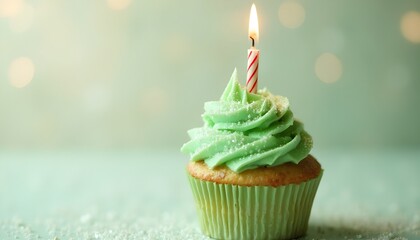 Green Frosted Cupcakes with Lit Candles - Elegant Celebration Desserts for Special Occasion