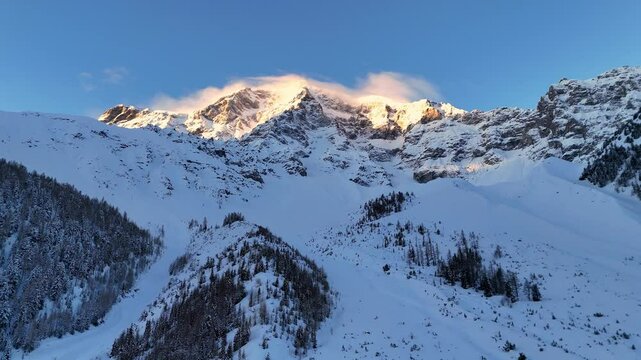 Dolly drone shot of the Ortler Mountain in the European Alps at sunrise
