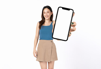 Beautiful Asian woman holding smartphone mockup of blank screen and smiling on white background.