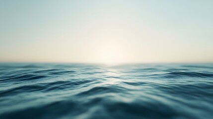 Obraz premium A serene view of calm ocean waters under a soft, hazy horizon.