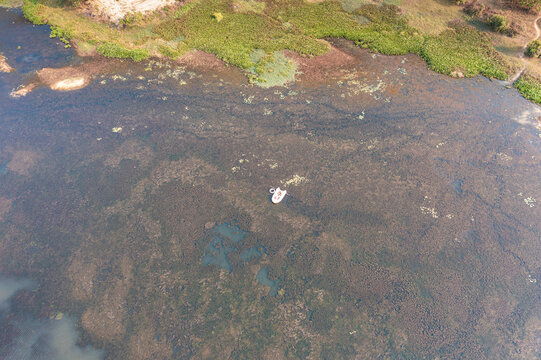 Aerial view of Brateak Krola Lake with rubber dinghy, Kampot, Cambodia