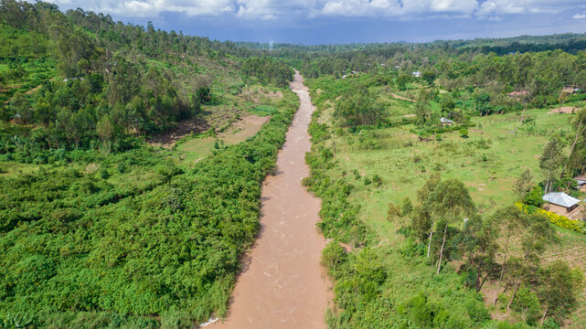 Aerial view of the beautiful River Yala flowing through lush green vegetation and trees, Sinaga, Kenya.