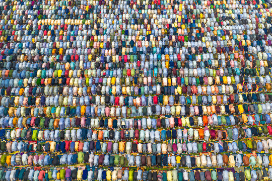 Aerial view of colorful crowd gathering for eid al-fitr prayers in a vibrant celebration, Subhadya, Keraniganj, Bangladesh.