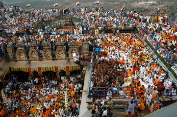 Aerial view of People from all over world gather for celebration of Mahamastakabhisheka head anointing ceremony of jain saint Gomateshwara lord Bahubali, Sravanabelagola, Karnataka, India