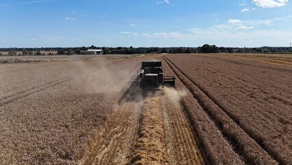 Naklejka premium .Combine havester in English farm field drone,aerial