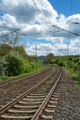 Naklejka premium Railway outdoors on beautiful summer day. Industrial landscape with rails and railway.