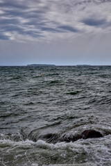 Cannes, France - September 7th 2024 : View of the Mediterranean Sea from the beach. The sea is restless, there are many waves.