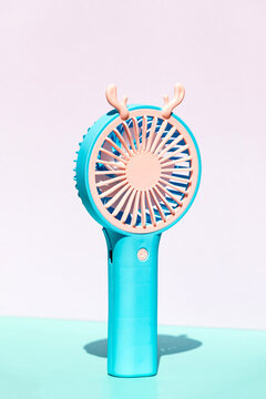Rechargeable portable fan with decorative antler design