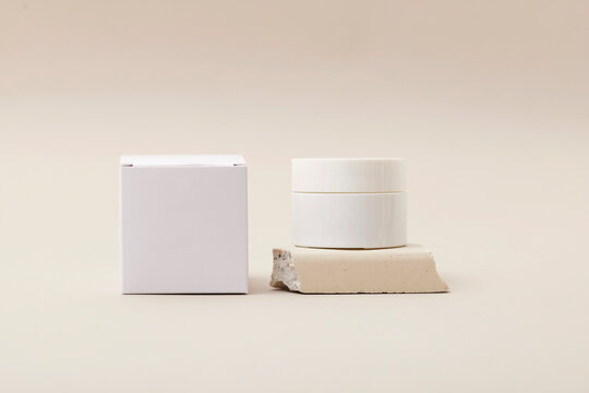 Elegant skin care products on plain background