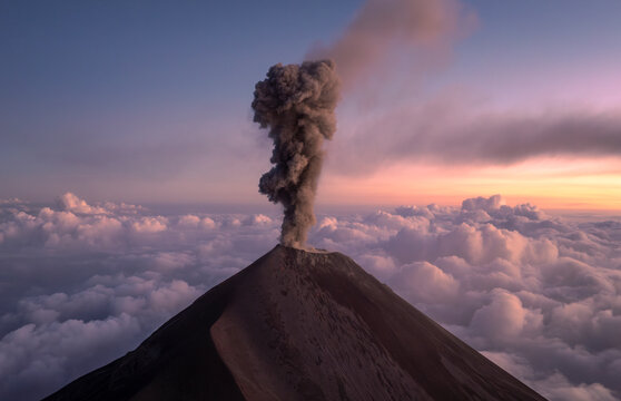 Aerial view of the erupting Fuego volcano with smoke and explosion above the crater, Chimaltenango, Guatemala.