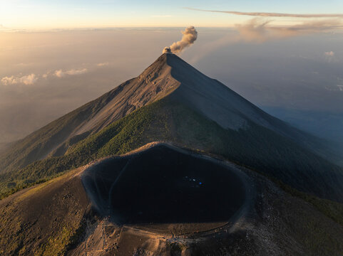 Aerial view of erupting Volcano Fuego with smoke plume and crater, Chimaltenango, Guatemala.
