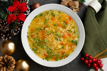 Vegetable soup with green beans and red pepper. Top view table with Christmas decoration.