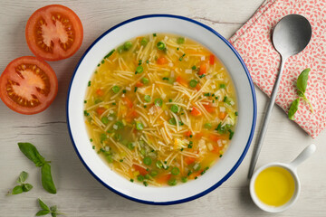 Vegetable soup with green beans and red pepper. Top view table with  decoration.