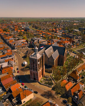 Aerial view of beautiful historic church and charming city with red roofs, Workum, Netherlands.
