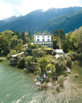 Aerial view of serene isole di brissago with beautiful villa surrounded by lush greenery and tranquil lake, Brissago, Switzerland.