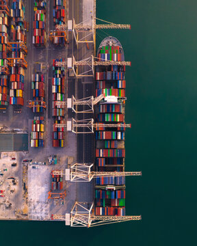 Aerial view of colorful container ships and cranes at the international container harbor, Koper, Slovenia.