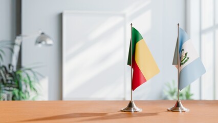 FLAGS OF BENIN AND GUATEMALA ON TABLE