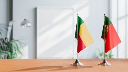 FLAGS OF BENIN AND PORTUGAL ON TABLE