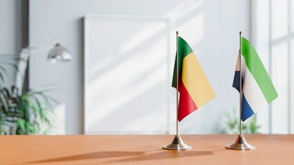 FLAGS OF BENIN AND SIERRA LEONE ON TABLE