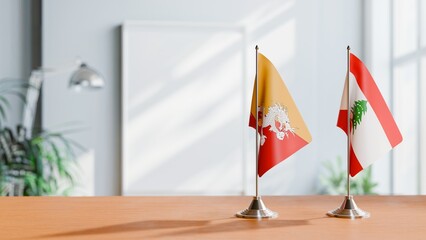 FLAGS OF BHUTAN AND LEBANON ON TABLE