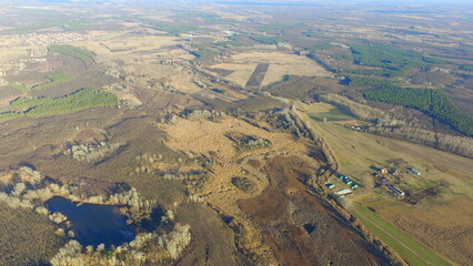 Aerial Autumn Landscape with Forest Textures and a Hidden Pond