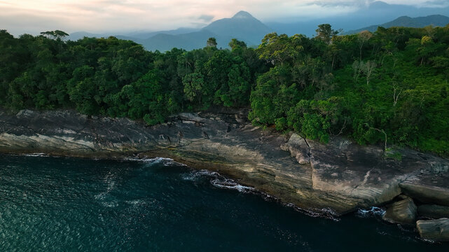 Aerial view of picturesque coastline with lush forest and majestic mountains, Paraty, Brazil.