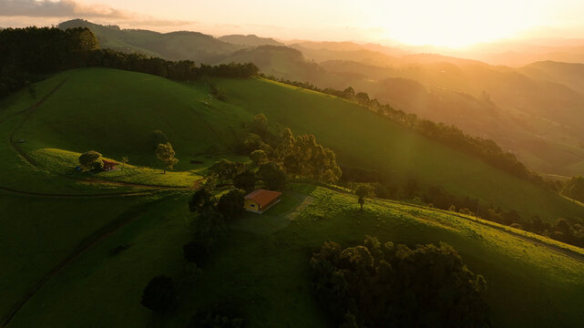Aerial view of lush rolling hills and trees at sunset, Monte Verde, Minas Gerais, Brazil.