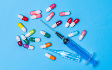 syringe with ampoule and capsules