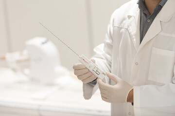 Doctor prepare prostate cancer biopsy device for use