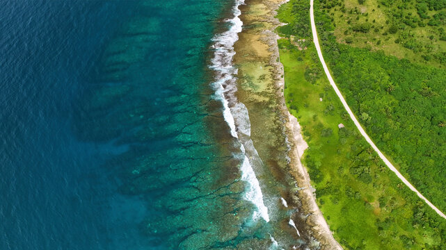 Aerial view of a tropical island with pristine beach, turquoise ocean, and lush greenery, Shefa, Vanuatu.