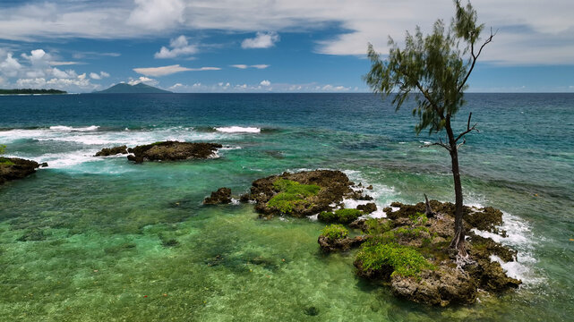 Aerial view of tropical island with beautiful reef and tranquil waves, Shefa, Vanuatu.