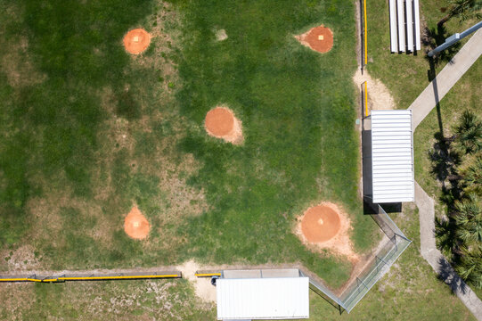 Aerial view of a beautiful baseball field surrounded by green grass and palm trees, Knecht Park, Palm Bay, Florida.