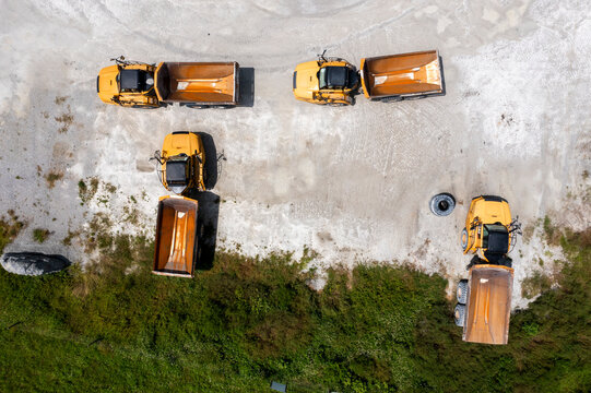 Aerial view of construction site with heavy machinery and trucks at Stavola Aggregate Supply, Fellsmere, Florida.