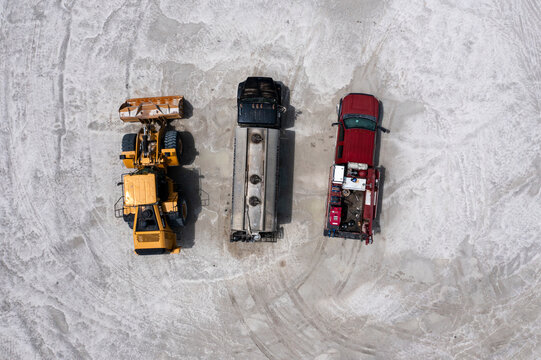 Aerial view of Stavola Aggregate Supply worksite with heavy machinery and vehicles, Fellsmere, United States.
