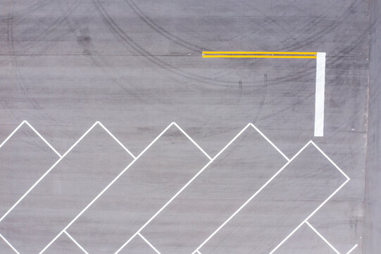 Aerial view of parking lot markings at an rv and boat storage facility construction site with geometric patterns, Wabasso, Florida, United States.