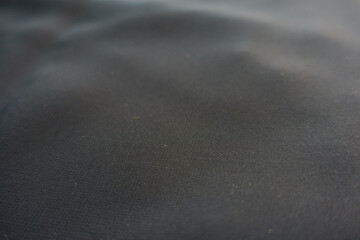 Closeup of thin anthracite grey nylon chiffon fabric