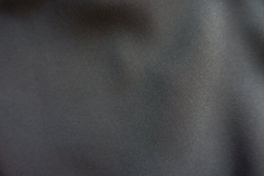 Texture of thin anthracite grey nylon chiffon fabric