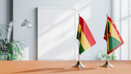 FLAGS OF BOLIVIA AND GRENADA ON TABLE